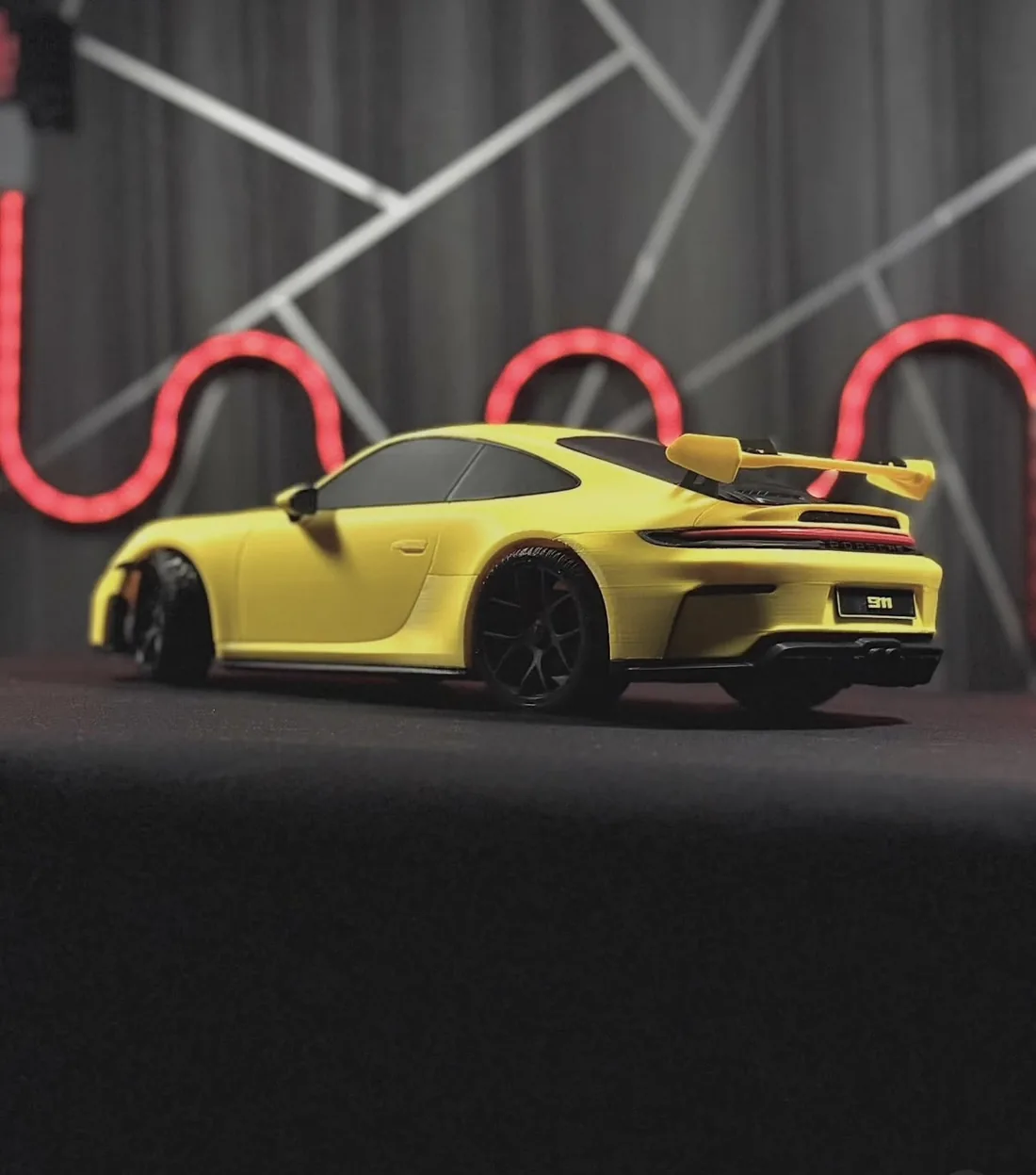 Yellow sports car scale model, custom 3D print, rear spoiler detail